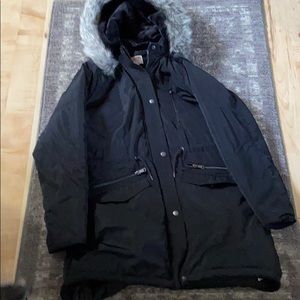 Women’s coat with faux fur button on hood